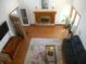 Open concept living room with fireplace and hardwood flooring, rug, sofa and decor at 315 King Charles Cir, Summerville, SC 29485