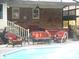 Cozy patio area with wicker furniture, hot tub, and a view of the refreshing swimming pool at 315 King Charles Cir, Summerville, SC 29485