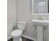 Modern bathroom featuring a pedestal sink and white tile at 320 Abercom Place Dr, Moncks Corner, SC 29461