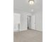 Bedroom with neutral carpeting and a view into the bathroom and hallway at 320 Abercom Place Dr, Moncks Corner, SC 29461