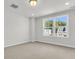 Well-lit bedroom with plush carpeting and large windows with neighborhood views at 320 Abercom Place Dr, Moncks Corner, SC 29461