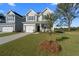 Beautiful two-story home boasts manicured lawn and attached garage at 320 Abercom Place Dr, Moncks Corner, SC 29461