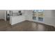 Bright and open floor plan with eat in kitchen featuring wood floors at 320 Abercom Place Dr, Moncks Corner, SC 29461