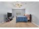 Comfortable bedroom featuring a ceiling fan, plush carpet, and a large television set at 324 Spruce Ivy St, Moncks Corner, SC 29461