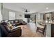 Open-concept living room with plush seating and a seamless transition to the outdoor patio at 324 Spruce Ivy St, Moncks Corner, SC 29461