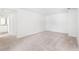 Large bedroom with neutral carpet and access to an ensuite bathroom, offering privacy and comfort at 336 Dickerson Ln, Lincolnville, SC 29485