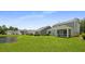 Scenic backyard with a serene pond and charming homes with screened porches at 336 Dickerson Ln, Summerville, SC 29485