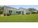 Expansive backyard showcases lush green lawn and inviting screened porch, perfect for relaxing at 336 Dickerson Ln, Summerville, SC 29485