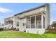 Well-maintained backyard with a screened-in porch, patio, grill, and scenic views at 366 Clayton Dr, Charleston, SC 29414