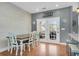 Bright dining area featuring access to the back patio through double doors and a shiplap accent wall at 366 Clayton Dr, Charleston, SC 29414