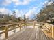 View from a wood dock with a bench overlooking the tranquil marsh at 366 Clayton Dr, Charleston, SC 29414
