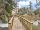 Wooden dock and walkway offer access to marsh views and nature at 366 Clayton Dr, Charleston, SC 29414