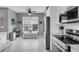 Bright kitchen with a breakfast nook, window seat, and stainless steel appliances at 366 Clayton Dr, Charleston, SC 29414