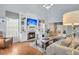 Spacious living room with fireplace, built-in shelving, and abundant natural light at 366 Clayton Dr, Charleston, SC 29414