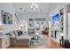 Bright living room featuring hardwood floors, a cozy fireplace, and a staircase at 366 Clayton Dr, Charleston, SC 29414