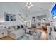 Bright living room featuring hardwood floors, a cozy fireplace, and a staircase at 366 Clayton Dr, Charleston, SC 29414