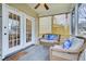 Cozy screened porch with comfortable seating, ideal for relaxing and enjoying the outdoors at 366 Clayton Dr, Charleston, SC 29414
