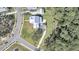 An aerial view of a charming white home nestled in a wooded area with a private driveway at 3864 Summerton St, Mount Pleasant, SC 29466