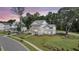 Expansive aerial view of a pristine home with lush green lawn, mature trees, and neighborhood street at 3864 Summerton St, Mount Pleasant, SC 29466
