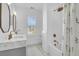 Bathroom with gray cabinets, double sinks and shower-tub combo at 3864 Summerton St, Mount Pleasant, SC 29466
