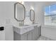 Bathroom featuring gray cabinets, double sinks with marble countertop at 3864 Summerton St, Mount Pleasant, SC 29466