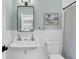 Classic bathroom with vintage-inspired sink, white subway tiles, and tasteful decor at 3864 Summerton St, Mount Pleasant, SC 29466