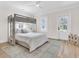 Bedroom featuring bunkbeds, light tone hardwood flooring and white doors at 3864 Summerton St, Mount Pleasant, SC 29466