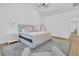 Spacious bedroom with vaulted ceilings, two windows, a reading chair and neutral decor at 3864 Summerton St, Mount Pleasant, SC 29466