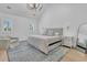 Spacious bedroom with vaulted ceilings, two windows, area rug and neutral decor at 3864 Summerton St, Mount Pleasant, SC 29466