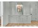 Stylish built-in storage cabinets in a cool grey tone with decorative painting on the wall at 3864 Summerton St, Mount Pleasant, SC 29466