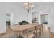Formal dining room with an elegant chandelier, piano, and views of the living spaces at 3864 Summerton St, Mount Pleasant, SC 29466