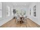 Bright dining room features a round wood table, wicker chairs, and window shutters at 3864 Summerton St, Mount Pleasant, SC 29466