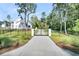 Long driveway leading to an iron gate, providing privacy and security for the estate at 3864 Summerton St, Mount Pleasant, SC 29466