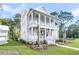 This two-story home offers a wrap-around porch with ceiling fans, perfect for outdoor relaxation at 3864 Summerton St, Mount Pleasant, SC 29466