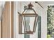Close-up of a charming gas lantern, exuding warmth and a welcoming ambiance to the exterior at 3864 Summerton St, Mount Pleasant, SC 29466