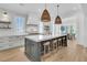 Bright, open kitchen with a large island, hardwood floors, and modern lighting at 3864 Summerton St, Mount Pleasant, SC 29466