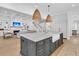Kitchen island with marble countertops, farmhouse sink, and elegant cabinetry at 3864 Summerton St, Mount Pleasant, SC 29466