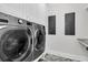 Laundry room with side-by-side washer and dryer and herringbone tile flooring at 3864 Summerton St, Mount Pleasant, SC 29466
