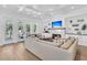 Spacious living room with fireplace, coffered ceiling, and sliding doors to the outdoor deck at 3864 Summerton St, Mount Pleasant, SC 29466