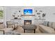 Cozy living room featuring a fireplace with a wooden mantel and built-in cabinets at 3864 Summerton St, Mount Pleasant, SC 29466