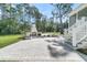 Picturesque outdoor fireplace and patio area, perfect for gatherings and enjoying the backyard at 3864 Summerton St, Mount Pleasant, SC 29466