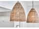 Close-up of woven pendant lights over a kitchen island at 3864 Summerton St, Mount Pleasant, SC 29466