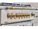 Close up of a professional gas range with brass knobs at 3864 Summerton St, Mount Pleasant, SC 29466