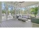 Cozy screened porch with comfortable seating, perfect for outdoor relaxation and entertaining at 3864 Summerton St, Mount Pleasant, SC 29466