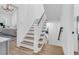 Bright staircase with hardwood treads and white risers, leading to upper and lower levels at 3864 Summerton St, Mount Pleasant, SC 29466