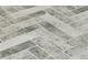 Close up of gray tone herringbone pattern tile flooring at 3864 Summerton St, Mount Pleasant, SC 29466