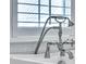 Close up of tub faucet with hand shower attachment and white wood plantation shutters at 3864 Summerton St, Mount Pleasant, SC 29466