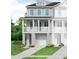 Charming home with covered porch, multiple windows, and an attached garage in a well-maintained community at 406 Katies Scenic Ct, Charleston, SC 29492