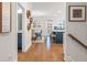 An open-concept home with a view into the dining and kitchen area with an island at 408 Katies Scenic Ct, Charleston, SC 29492