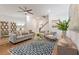 Comfortable living room showcasing contemporary decor, hardwood floors, and ample seating at 408 Katies Scenic Ct, Charleston, SC 29492